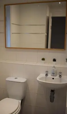 a bathroom with a toilet and a sink at 3 Bedroom-Kelpies Serviced Apartments Burns in Falkirk