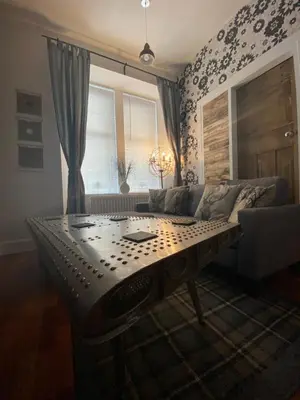 a living room with a couch and a table at Glasgow City Centre Apartment in Glasgow