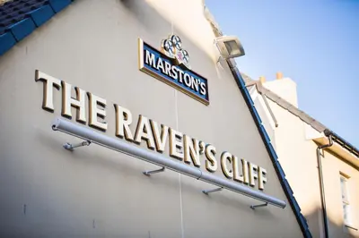 a sign for the reserves clinic on the side of a building at The Raven’s Cliff Lodge by Marston's Inns in Motherwell