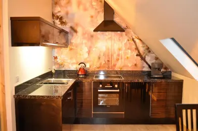 a kitchen with a sink and a counter top at Finlaystone Barns in Port Glasgow