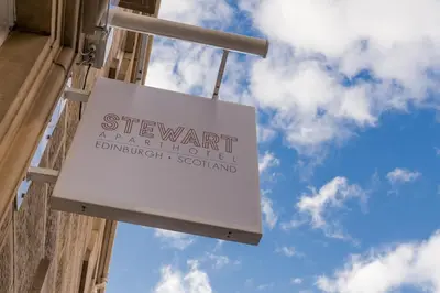 a sign on the side of a building at Stewart by Heeton Concept - Aparthotel Edinburgh in Edinburgh