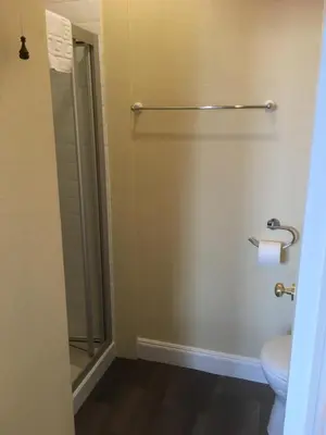 a bathroom with a shower stall and a toilet at Dunivaig B&B in Tarbert