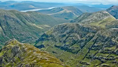 an aerial view of a mountain range with mountains at The Old Stables, Alltshellach Cottages in North Ballachulish