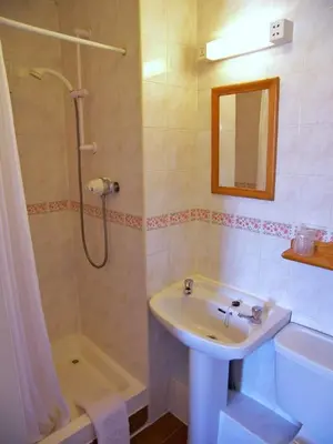 a bathroom with a sink and a shower at Ardleigh House in Edinburgh