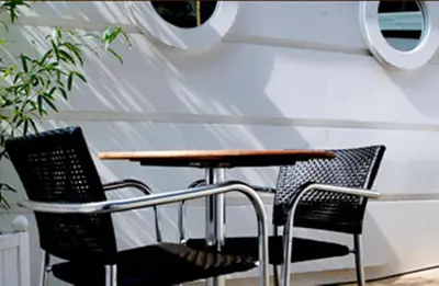 a table and two chairs sitting next to a table at Artto Hotel in Glasgow