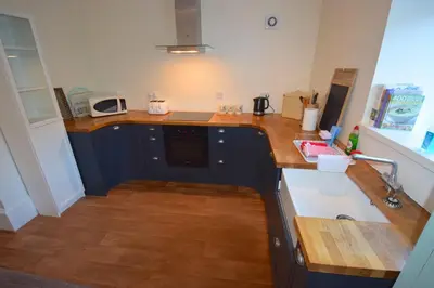 a kitchen with a counter top and a sink at Beach House - Carrick Castle in Carrick