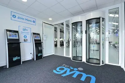 a room with a row of machines in a building at Glasgow Central Station SKYLINE Apartment with Parking (2 bedrooms, 2 bathrooms, 1 living room-Kitchen) in Glasgow