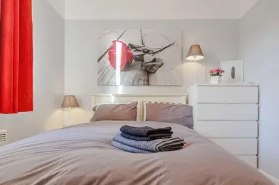 a bedroom with a bed with towels on it at Linlithgow Apartment in Linlithgow