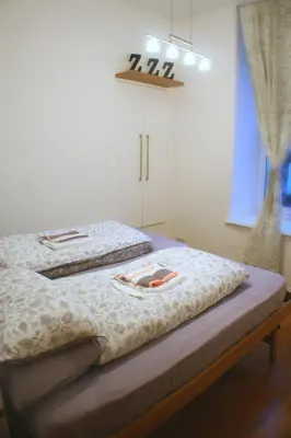 two beds sitting next to each other in a room at The Lookout in Helensburgh