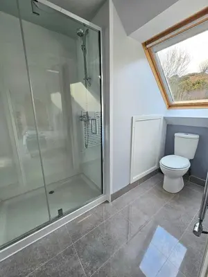 a bathroom with a shower and a toilet at Seabank Lodge in Oban