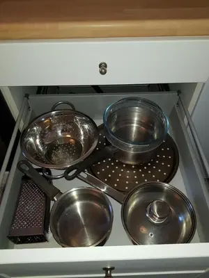 four pots and pans sitting on top of a stove at Millhill St Dunfermline in Dunfermline