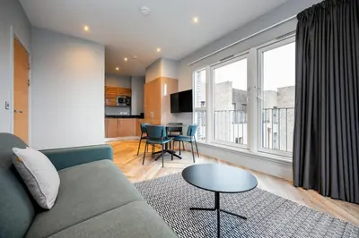 a living room with a couch and a table at Staycity Aparthotels Edinburgh West End in Edinburgh