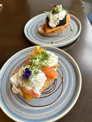 two plates of food sitting on a table at Crookston Hotel in Glasgow