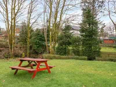 a picnic table in the grass in a yard at The Knowe Lower in Taynuilt