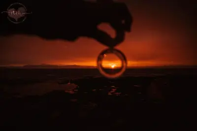 a sunset seen through a ring in the sky at Troon Beachcombers in Troon