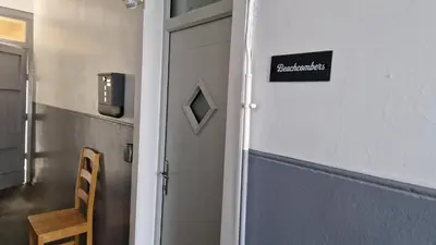 a door to a classroom with a sign on the wall at Troon Beachcombers in Troon