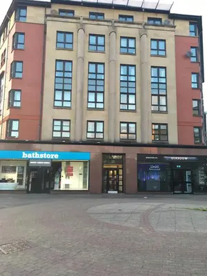 a large building with a lot of windows at Central West End City Apartment in Glasgow