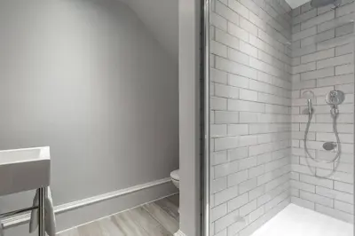 a bathroom with a shower and a toilet at JOIVY Luxurious Home near Haymarket Station in Edinburgh