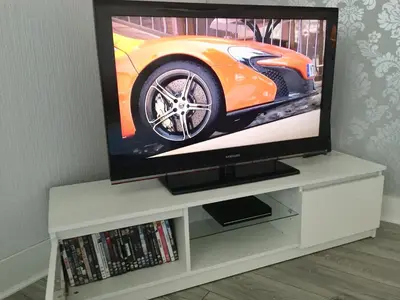 a flat screen tv sitting on a white entertainment center at RIVER CLYDE VIEWS - PRIVATE & SPACIOUS APARTMENT in Port Glasgow