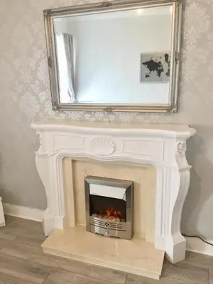 a fireplace with a mirror on top of it at RIVER CLYDE VIEWS - PRIVATE & SPACIOUS APARTMENT in Port Glasgow