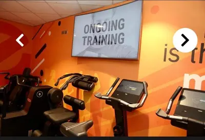 a gym with a sign that sayswrong training at RIVER CLYDE VIEWS - PRIVATE & SPACIOUS APARTMENT in Port Glasgow