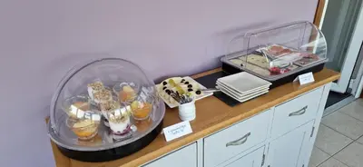 a counter with food and other items on it at Craigbank Guest House in Crianlarich