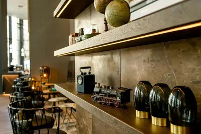 a counter in a restaurant with a train on it at Motel One Glasgow in Glasgow