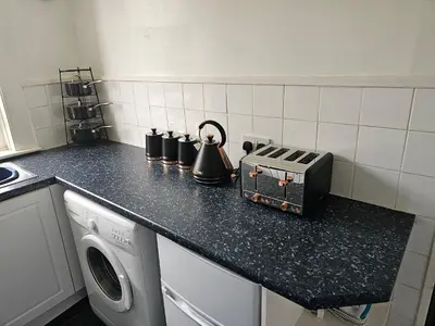 a kitchen with a counter top with a appliance on it at Snug - Meadhan Apartment in Helensburgh