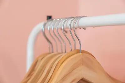 a wooden jacket hanging on a rack at Unique Victorian Home in Glasgow in Glasgow