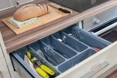 an open drawer in a kitchen with a loaf of bread at Glasgow City Flats in Glasgow