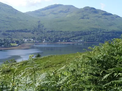 a view of a lake with mountains in the background at TwoStones in Arrochar