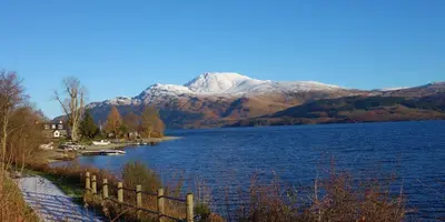 a view of a lake with a mountain in the background at 3 Knocknaha Cottage in Campbeltown