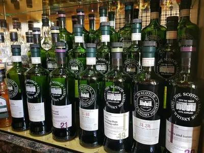 a bunch of bottles of wine on a shelf at Ardshiel Hotel in Campbeltown