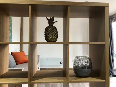 a wooden cabinet with a pineapple on top of it at Finlaystone Family Barn in Port Glasgow