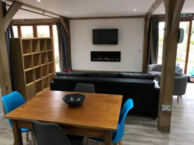a living room with a table and a couch at Finlaystone Family Barn in Port Glasgow