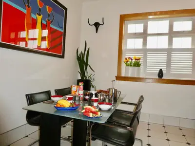 a table with food on it in a room at The Cairn Residence in Edinburgh