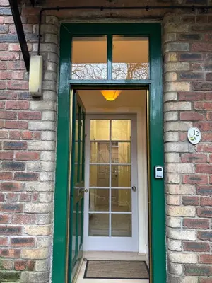 a front door of a brick building at The cosy courtyard in Edinburgh