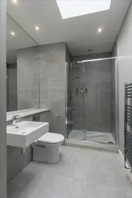 a bathroom with a shower and a toilet and a sink at Destiny Scotland Apartments at Canning Street Lane in Edinburgh