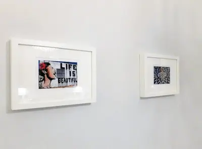 two pictures hanging on a white wall at Stylish City Centre Apartments - D Terrace Residence in Edinburgh