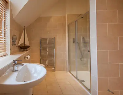 a bathroom with a sink and a shower at Mains of Taymouth Country Estate 5* Maxwell Villas in Kenmore