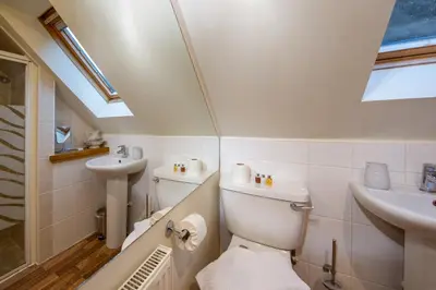 a bathroom with a toilet and a sink at Mains of Taymouth Country Estate 4* Houses in Kenmore