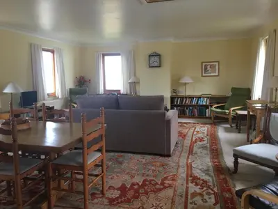 a living room with a couch and a table at Shieling Holidays Mull in Craignure