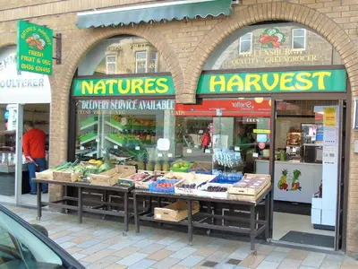 a store front of a market with fruits and vegetables at Snug - Tùr Sealladh Apartment in Helensburgh