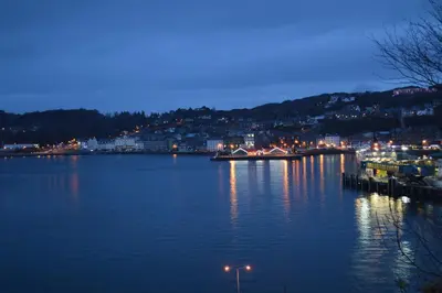 a large body of water at night with a town at Gramarvin B&B in Oban