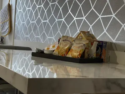 a counter top with a tray of food on it at HLA - KING COURT APARTMENT 2 in Motherwell