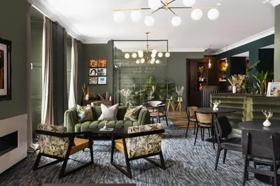 a living room with a couch and a table at Heeton Concept Aparthotel Edinburgh Queen Street in Edinburgh
