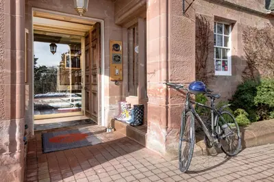 a bike parked in front of a building at Cringletie House in Peebles