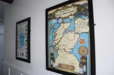 a map of the united kingdom hanging on a wall at Harbourside Hotel in Irvine
