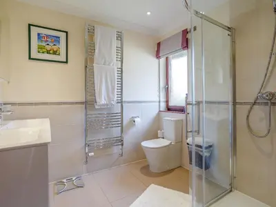 a bathroom with a toilet and a glass shower at Ard Taigh in Stron-fearnan
