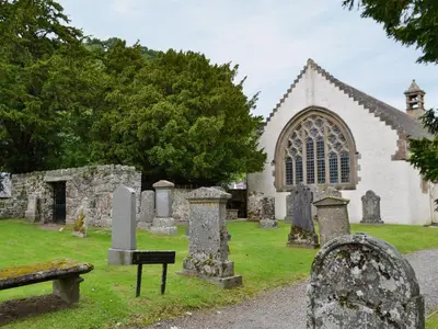 a church with a bunch of graves in front of it at Ard Taigh in Stron-fearnan